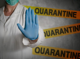 Health Worker Gesturing Stop Sign In Quarantine.